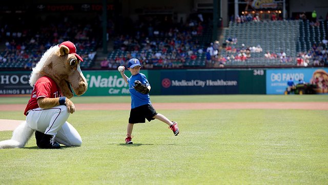5-year-old adopted through Buckner throws out first pitch at Texas Rangers  game · Foster Care and Adoption · Buckner International