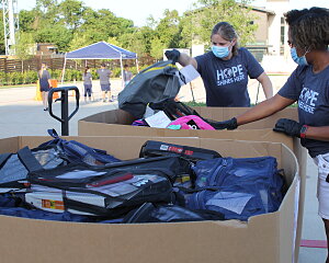 backpacks distributed to families in bachman lake