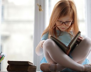 girl in blue dress reading a book 3887493
